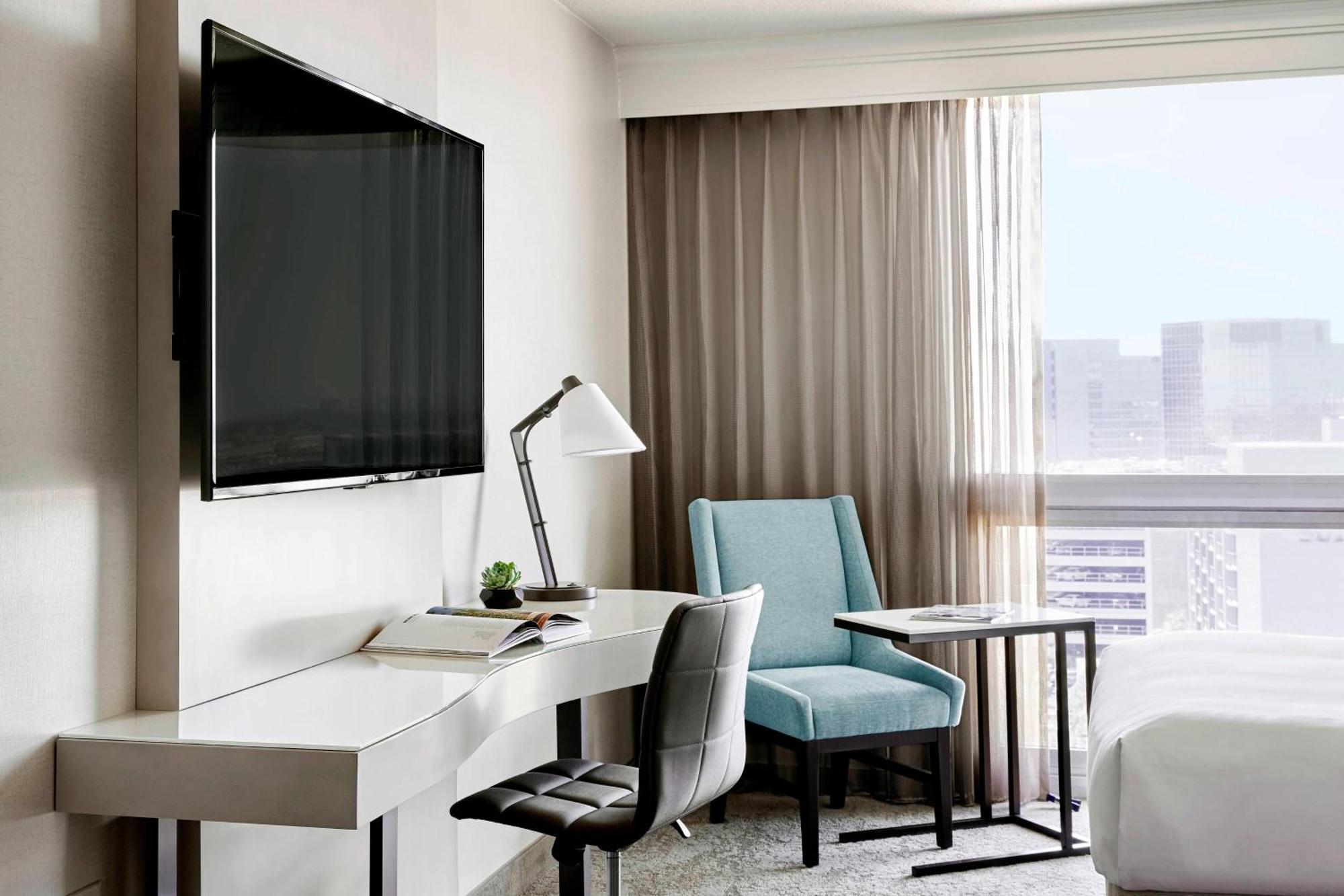 Guest Room with Two Double Beds, Balcony and Pool View
